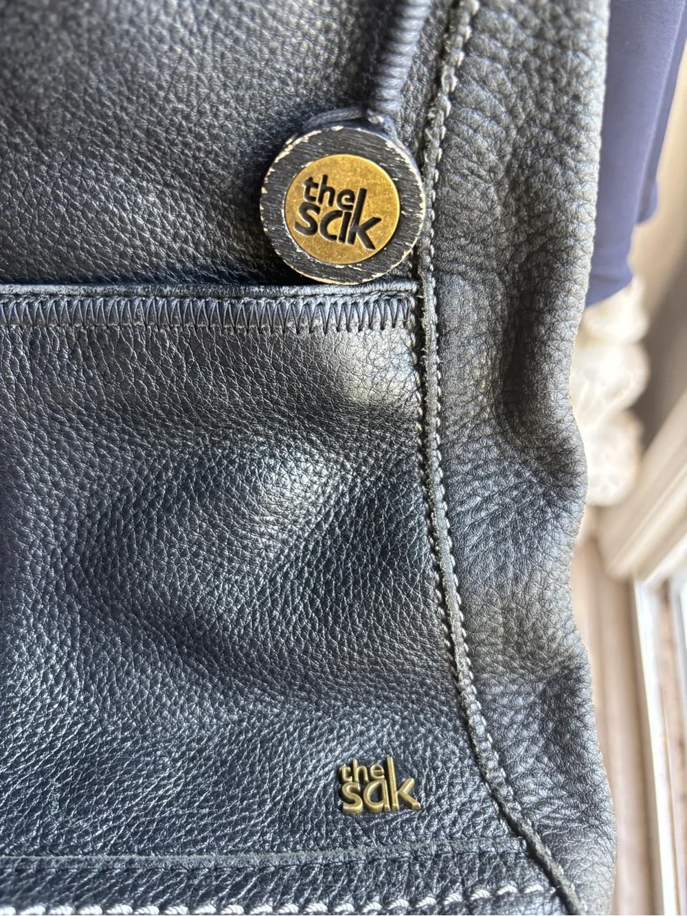 The Sak Black Leather Pebbled Crossbody with Gold Accents